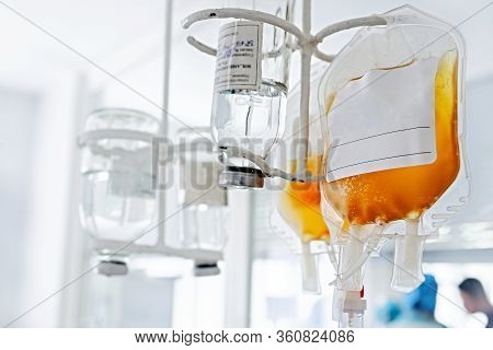 A Bottle Of Medicine Connected To The System