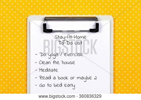 To Do List Made Of Clipboard And White Sheet Of Paper With Text On Vibrant Yellow Polka Dot Backgrou