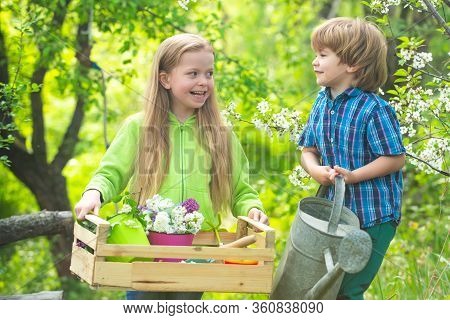 Environmental Conservation Concept. Cute Toddler Girl And Boy Working On Farm Outdoors. Childhood Co