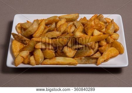Garlic French Fries On A White Plate. Patata Frita