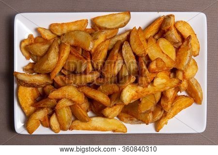 Garlic French Fries On A White Plate. Patata Frita