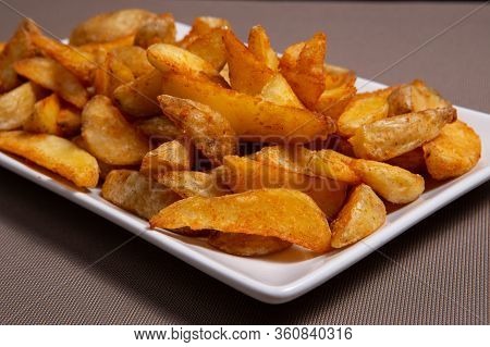 Garlic French Fries On A White Plate. Patata Frita
