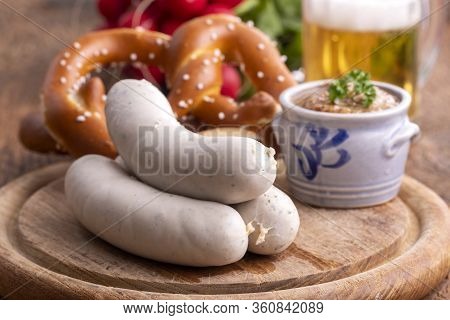 Closeup Of Three Bavarian White Sausages With Mustard