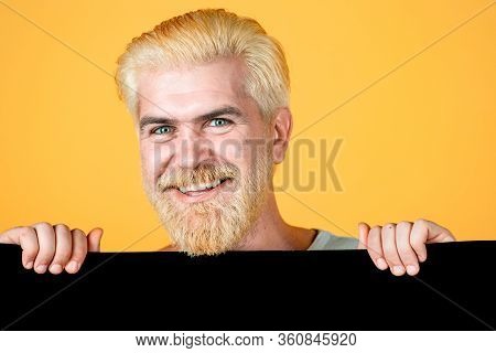 Man Holding Blank Paper Board Studio Portrait. Blank, Empty Paper, Billboard With Copy Space For Tex