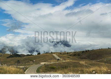 Summer Road In Countryside With Gloomy Cloudscape