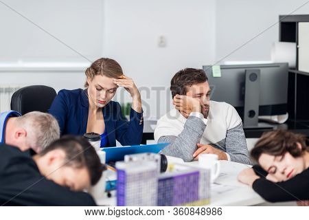 Business People Sleeping In The Conference Room During A Meeting, Focus On A Woman