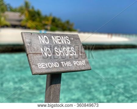 Sign On The Beach Made Of Wood