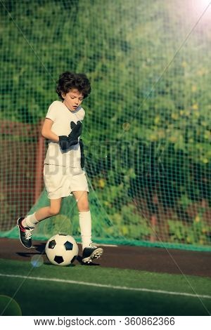 Summer Soccer Tournament For Young Kids. Football Club. Emotions And Joy Of The Game. Young Goalie. 
