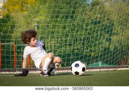 Summer Soccer Tournament For Young Kids. Football Club. Emotions And Joy Of The Game. Young Goalie. 