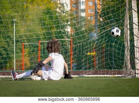 Summer Soccer Tournament For Young Kids. Football Club. Emotions And Joy Of The Game. Young Goalie. 
