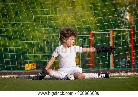 Summer Soccer Tournament For Young Kids. Football Club. Emotions And Joy Of The Game. Young Goalie. 