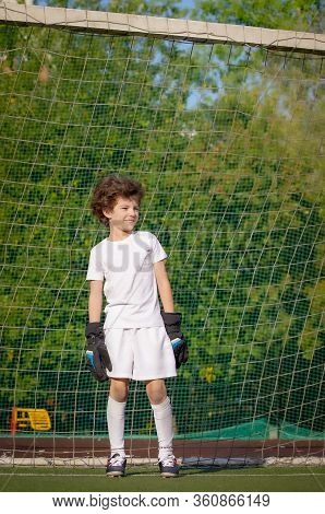 Summer Soccer Tournament For Young Kids. Football Club. Emotions And Joy Of The Game. Young Goalie. 