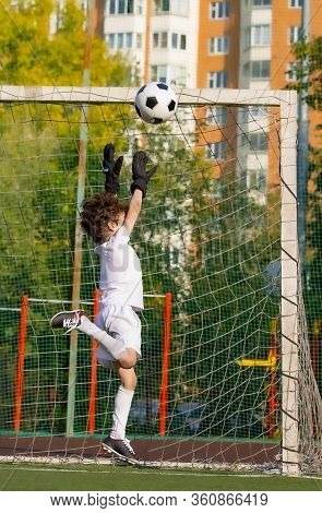 Summer Soccer Tournament For Young Kids. Football Club. Emotions And Joy Of The Game. Young Goalie. 