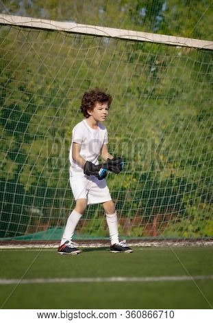 Summer Soccer Tournament For Young Kids. Football Club. Emotions And Joy Of The Game. Young Goalie. 