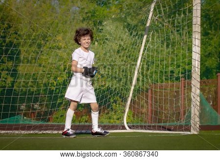 Summer Soccer Tournament For Young Kids. Football Club. Emotions And Joy Of The Game. Young Goalie. 