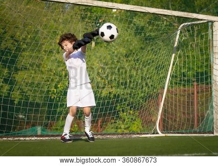 Summer Soccer Tournament For Young Kids. Football Club. Emotions And Joy Of The Game. Young Goalie. 