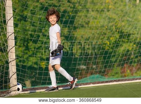 Summer Soccer Tournament For Young Kids. Football Club. Emotions And Joy Of The Game. Young Goalie. 