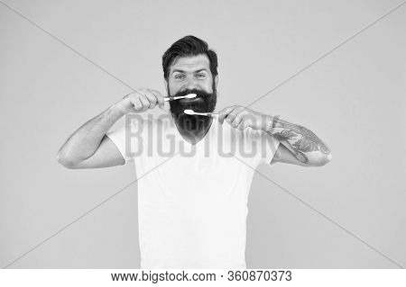 Make Your Teeth Breathe. Happy Hipster Brush Teeth Yellow Background. Bearded Man Keep Teeth Healthy