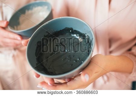 Close-up Face Mask In A Bowl. Two Young Women In Towels And Pajamas Have A Fun Spa Party Together In