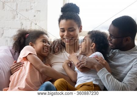 Close Up African American Happy Family With Two Children Enjoy.