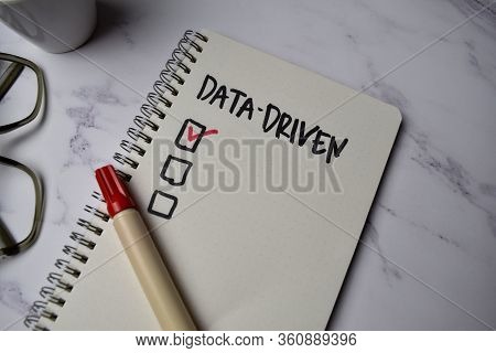 Data Driven Write On A Book Isolated On Office Desk