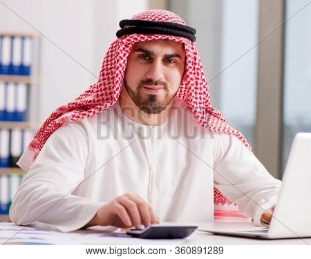 Arab businessman working on laptop computer