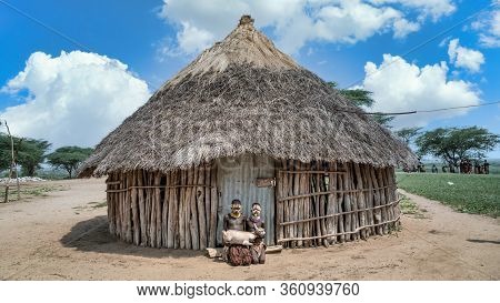 Omo Valley, Ethiopia - September 2017: Portrait Of Unidentified Karo Tribe Children Holding A Goat, 