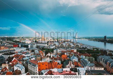 Riga, Latvia. Rainbow Over Cityscape. Building Of Latvian Academy Of Sciences, Built On Model Of Mos