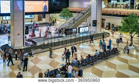 Baku, Azerbaijan - July 2019: Arrived Passengers Collecting Their Luggage In Heydar Aliyev Airport