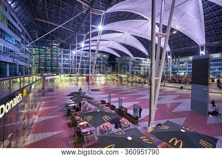 MUNICH, GERMANY - CIRCA JANUARY, 2020: view of the Munich Airport Center in the evening. The Munich Airport Center is a shopping, business, and recreation area that connects the terminals