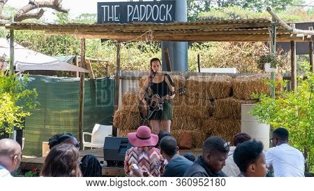 Johannesburg, South Africa - October 2019: Performer Singing On Stage In Fourways Farmers Market Wit