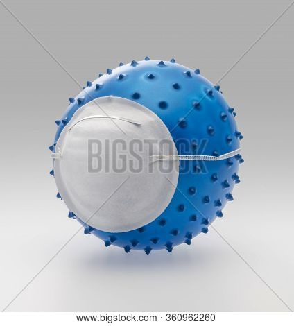 Picture Of A Symbolic Blue Virus Wearing A Face Mask In Light Back