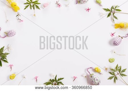 Easter Background With Easter Eggs And Spring Flowers. Top View With Copy Space