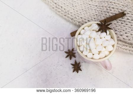 Marshmallows In Enameled Mug With Star Anise And Cinnamon Stick