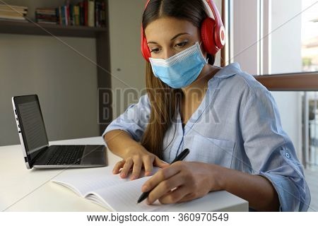 Covid-19 Pandemic Coronavirus Home Schooling E-learning Student Girl Mask Study From Home Laptop. Qu