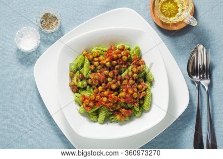 Italian Fresh Traditional Sardinian Pasta Gnocchi With Spinach And Green Pea Tomato Sauce. Spring Pa