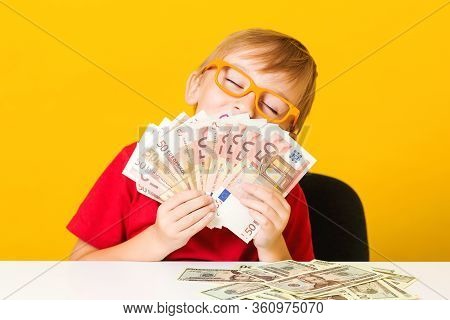 Happy Child Showing Fan Of Money. Money For Future Education. Cute Boy Acount His Money. Financial L