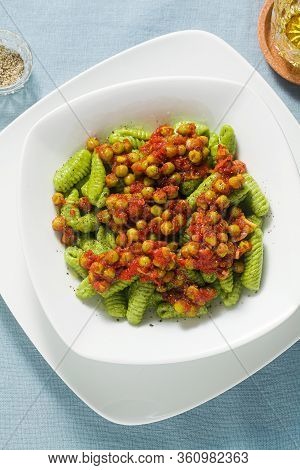 Italian Fresh Traditional Sardinian Pasta Gnocchi With Spinach And Green Pea Tomato Sauce. Spring Pa