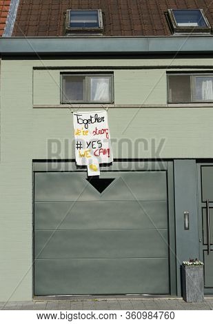 Belgium, Sint Gillis Waas, 08 04 2020, During The Coronavirus Covid 19, People Hang Banners On Their