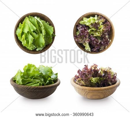 Young Lettuce Leaves In Wooden Bowl. Top View. Lettuce Isolated On A White Background. Green And Red