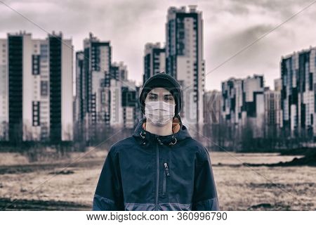 Teen Wearing A Medical Mask Against The Background Of A City Against Quarantine