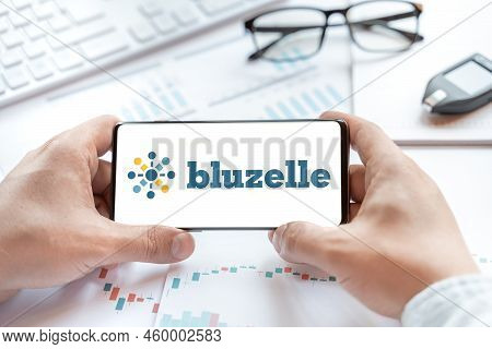 Logo Of Bluzelle Coin In Tablet. Cryptocurrency Blz Token. Trading Blockchain Platform To Buy,sell O