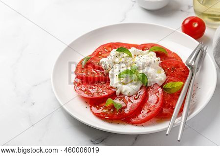 Italian Caprese Salad With Stracciatella, Tomatoes And Basil. Copy Space