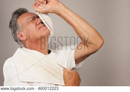 Mature Man 60plus Doing Back Of The Neck Stretches For Back And Neck Pain Relief