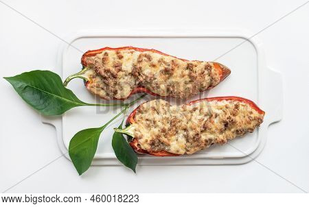 Sausage And Cheese Stuffed Red Peppers On White