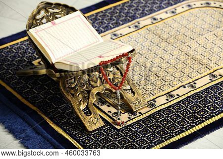 Rehal With Open Quran And Misbaha On Muslim Prayer Rug, Space For Text