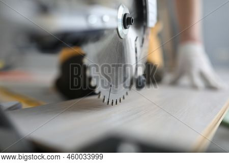Master Cutting Piece Of Laminated Wood Shelves With Manual Electric Saw In Apartment. Laminate Cutti