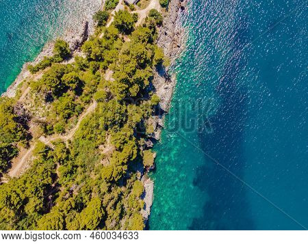 Picturesque Sea Adriatic Coast Of Montenegro. Turquoise Mediteran Sea And Rocky Shore With Evergreen