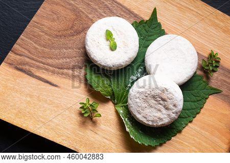 Food Concept French Organic Goat Cheese Picodon Form Southern France On Wooden Board With Copy Space