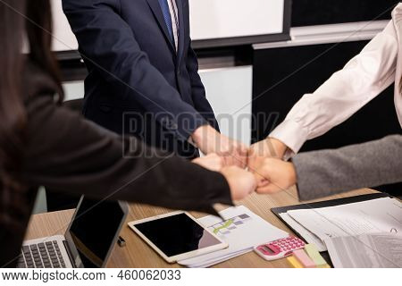 Business People Join Punching Fists Bump Hands As Team Their Meeting, Giving Touch Punch Together Of